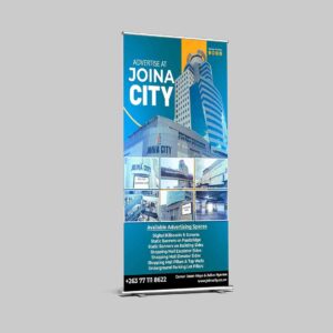 Professional pull-up banner design for Joina City by Kakic Business. Features clean corporate branding, high-resolution lifestyle imagery, and promotional event details displayed on a premium indoor banner stand.