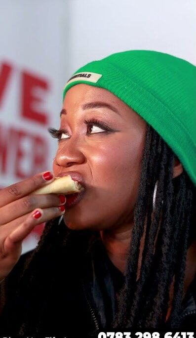 Video thumbnail for a Pizza Hut Fife Avenue social media reel: A close-up, high-definition shot of a woman in a green beanie enjoying a slice of pizza. Includes the branch contact number 0783 298 6413 at the bottom