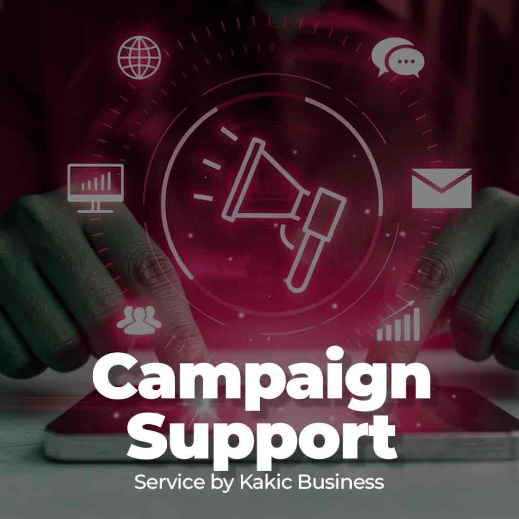 Social Media Campaign Support service button for Kakic Business. Close-up of a team member's hands typing on a laptop with a smartphone nearby, representing real-time community management and digital campaign execution.