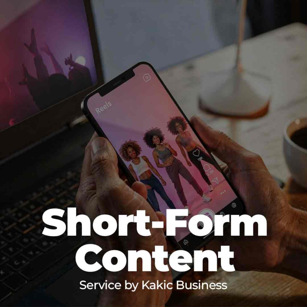 Short-Form Content service button for Kakic Business. Features a person holding a smartphone displaying an Instagram Reels interface with high-energy creators, highlighting vertical video production for TikTok and social media