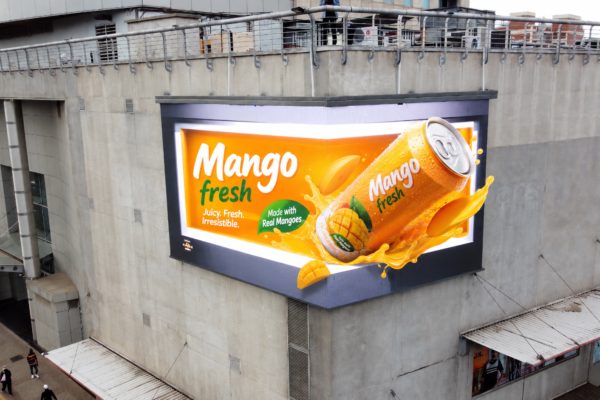 3D anamorphic digital billboard advertisement for Mango Fresh juice at Joina City. Kakic Business designed the forced-perspective 3D animation featuring a hyper-realistic beverage can bursting out of the screen with liquid splashes.